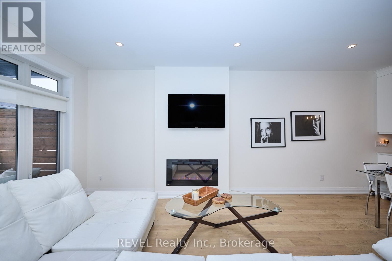20 - 8974 Willoughby Drive, Niagara Falls (Chippawa), ON - Indoor Photo Showing Living Room With Fireplace