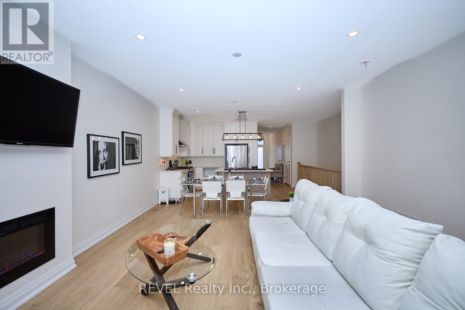 20 - 8974 Willoughby Drive, Niagara Falls (Chippawa), ON - Indoor Photo Showing Living Room With Fireplace