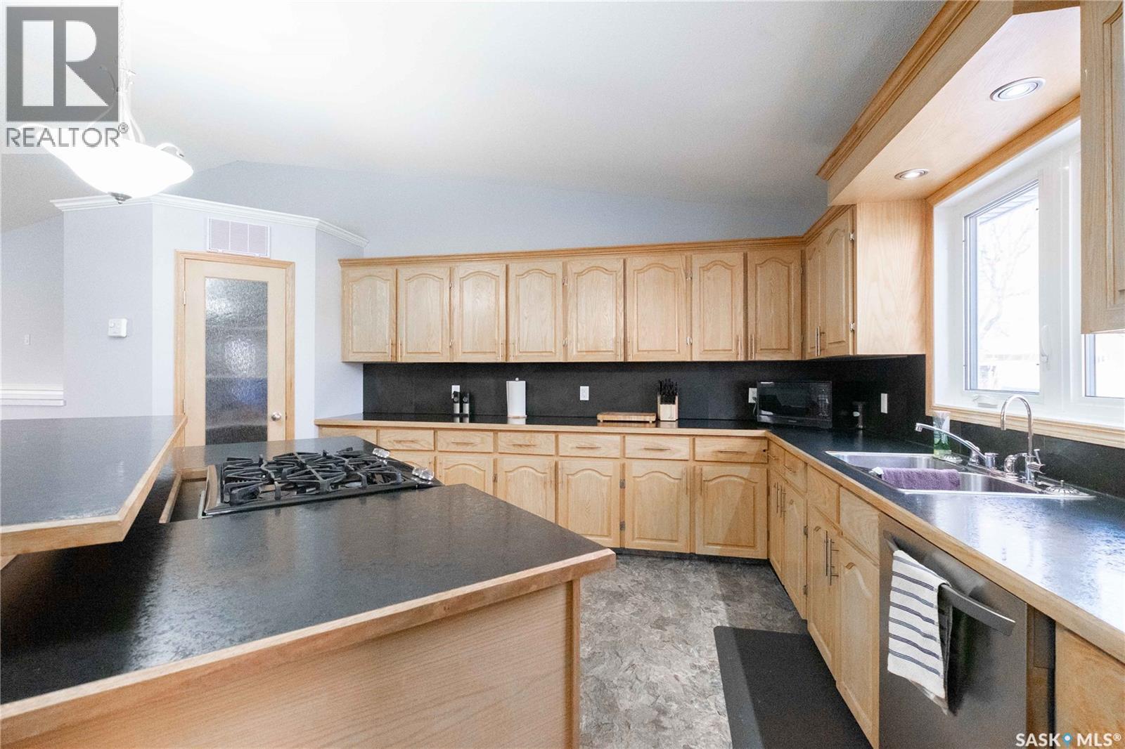 143 6Th Street, Pilot Butte, SK - Indoor Photo Showing Kitchen With Double Sink