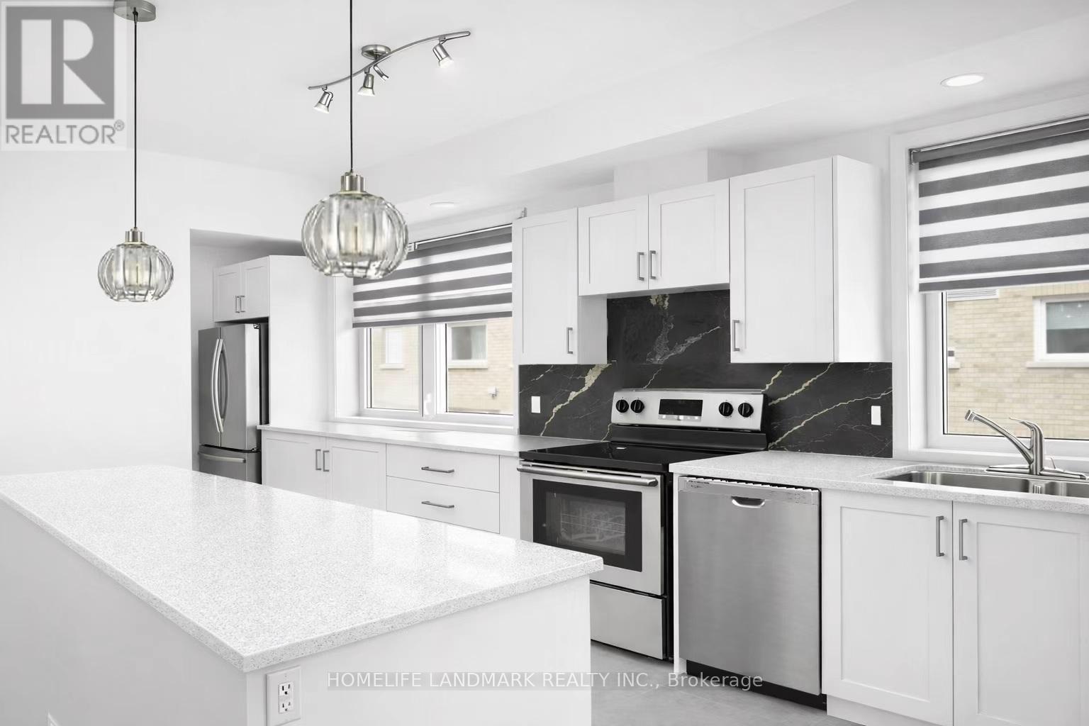 253 - 1095 Douglas Mccurdy Common, Mississauga, ON - Indoor Photo Showing Kitchen With Double Sink