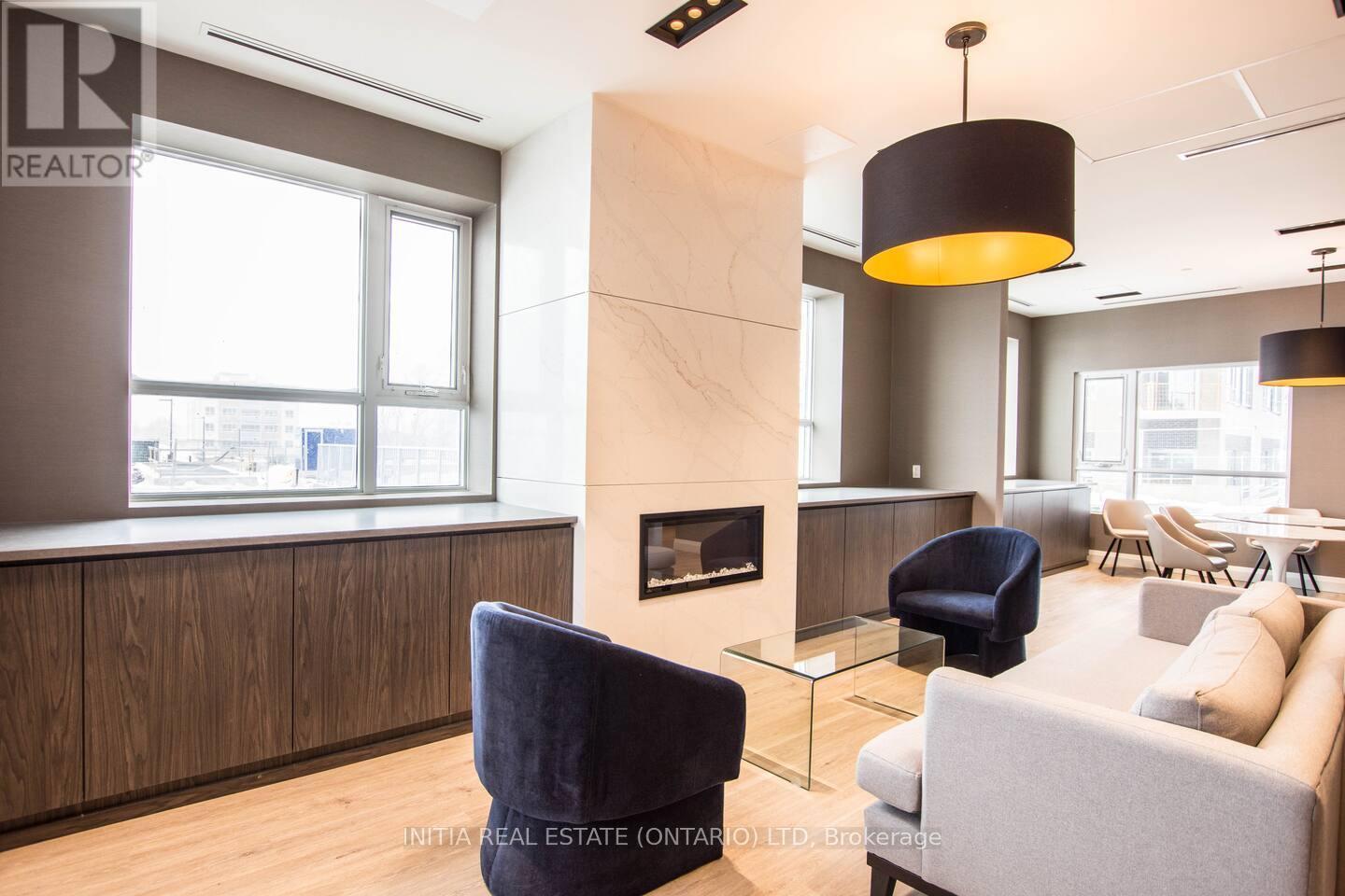 110 - 58 Lakeside Terrace, Barrie (Little Lake), ON - Indoor With Fireplace