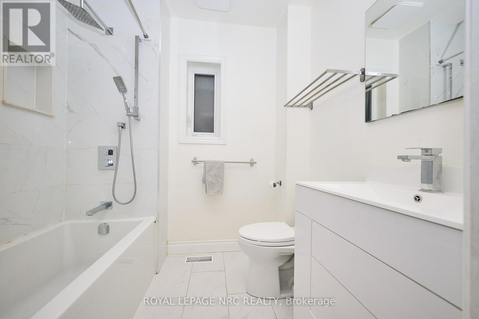 The updated 4-piece bathroom. - 29 Trapnell Street, St. Catharines (E. Chester), ON - Indoor Photo Showing Bathroom