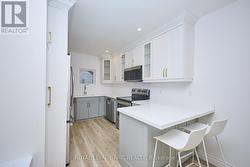 The kitchen offers a dining nook. -