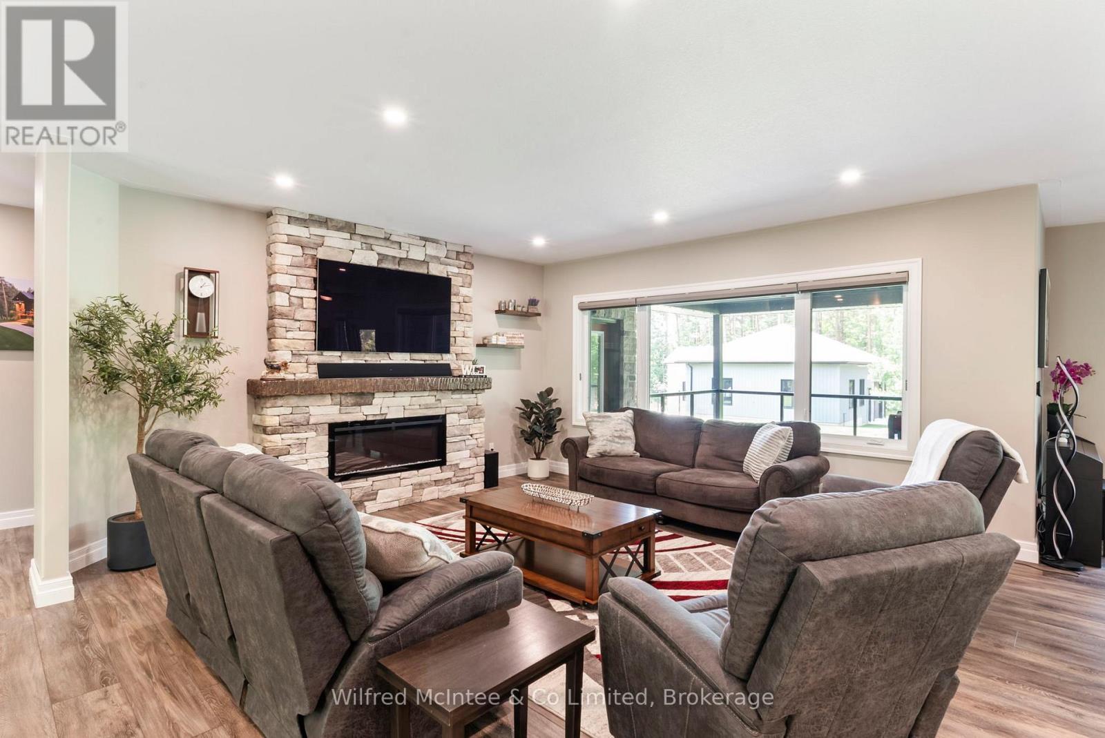 126 Forest Creek Trail, West Grey, ON - Indoor Photo Showing Living Room With Fireplace