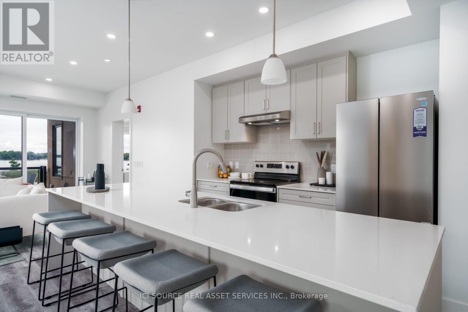 208 - 19B West Street N, Kawartha Lakes, ON - Indoor Photo Showing Kitchen With Stainless Steel Kitchen With Double Sink With Upgraded Kitchen