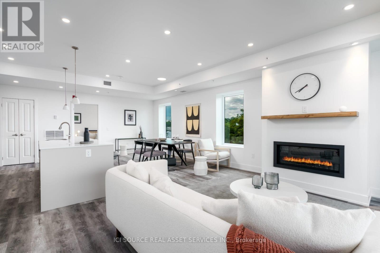 208 - 19B West Street N, Kawartha Lakes, ON - Indoor Photo Showing Living Room With Fireplace