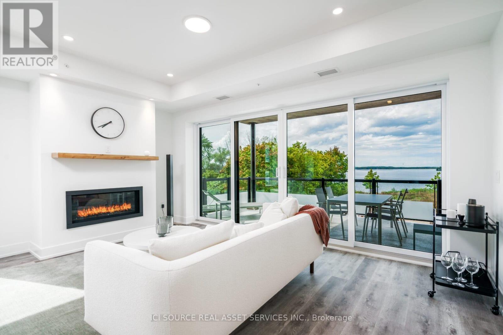 208 - 19B West Street N, Kawartha Lakes, ON - Indoor Photo Showing Living Room With Fireplace