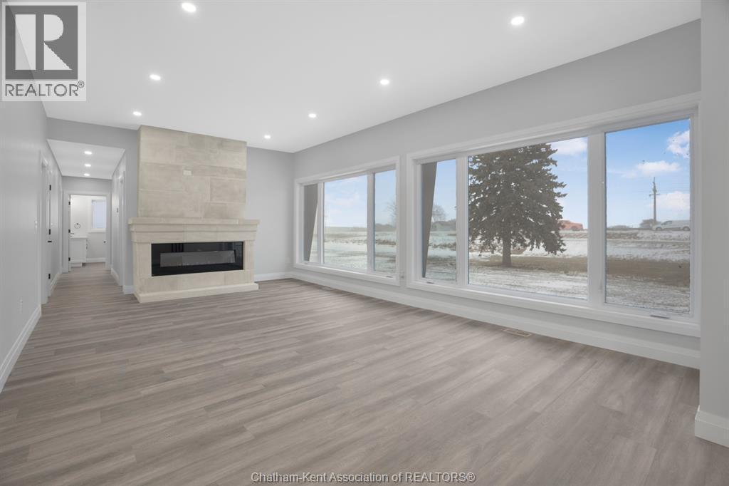 6511 Queens Line, Raleigh Township, ON - Indoor Photo Showing Other Room With Fireplace