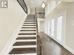 Stairs to 2nd Floor and Doors to Side Patio -