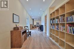 Hallway to addition leading to main fl. office/gym -