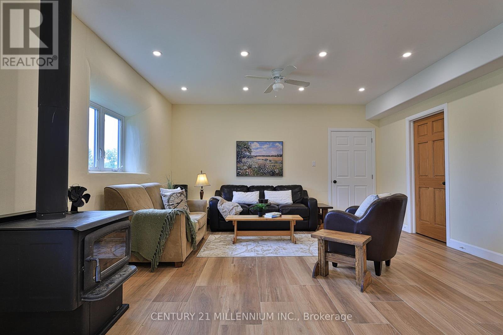 window, pot lights galore & door to apartment - 322066 Concession Road 6-7, East Luther Grand Valley, ON - Indoor Photo Showing Living Room
