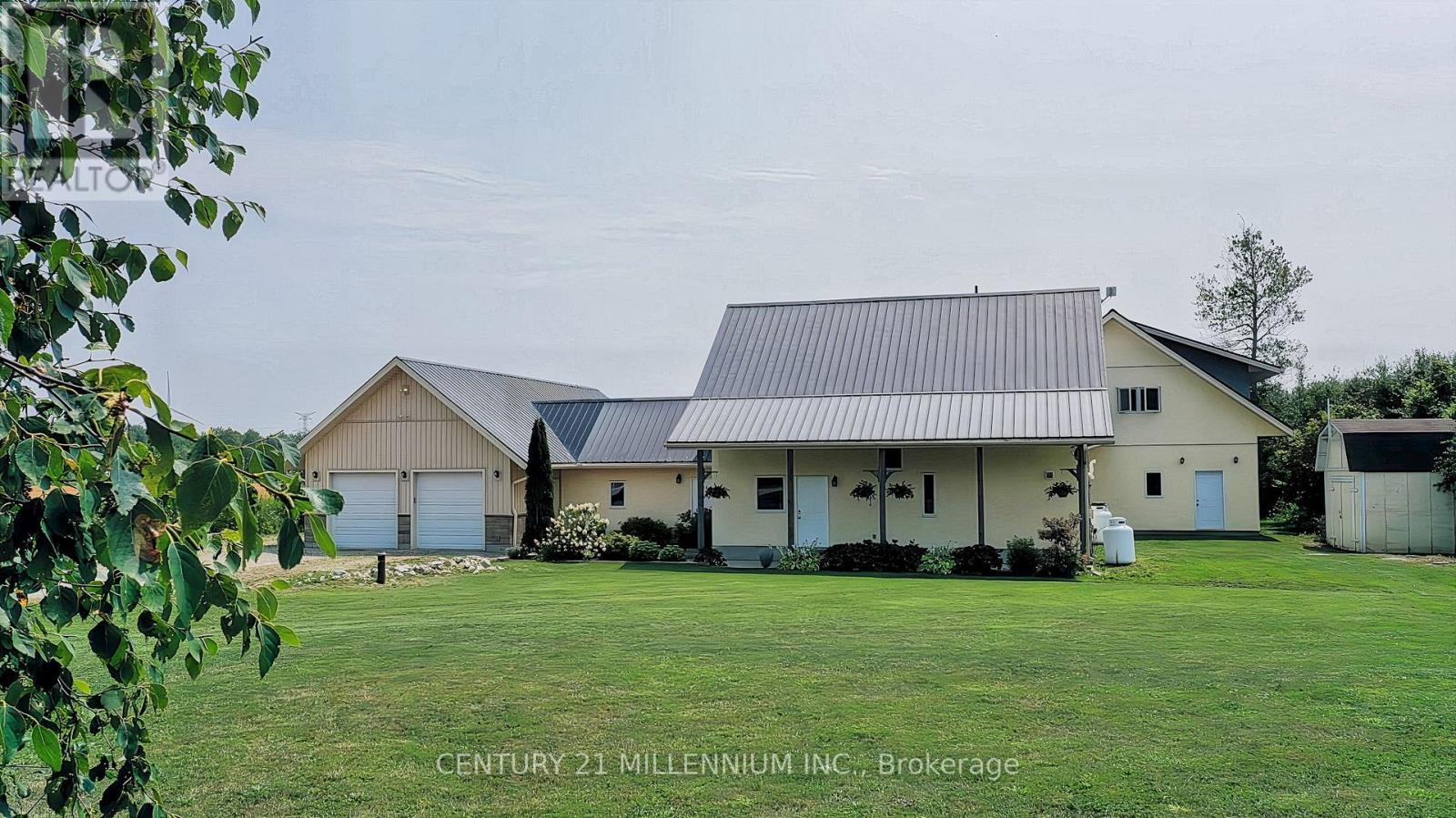 Summer photo- lovely front perennial gardens - 322066 Concession Road 6-7, East Luther Grand Valley, ON - Outdoor