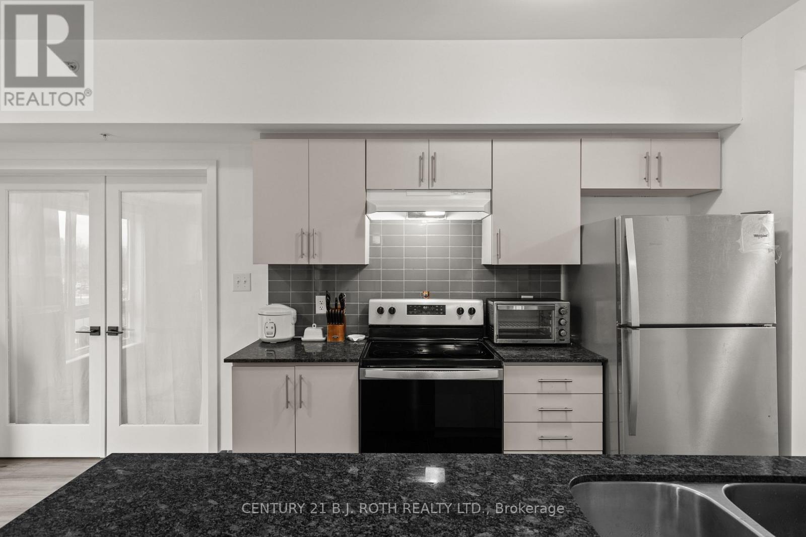 117 - 4 Spice Way, Barrie, ON - Indoor Photo Showing Kitchen With Double Sink