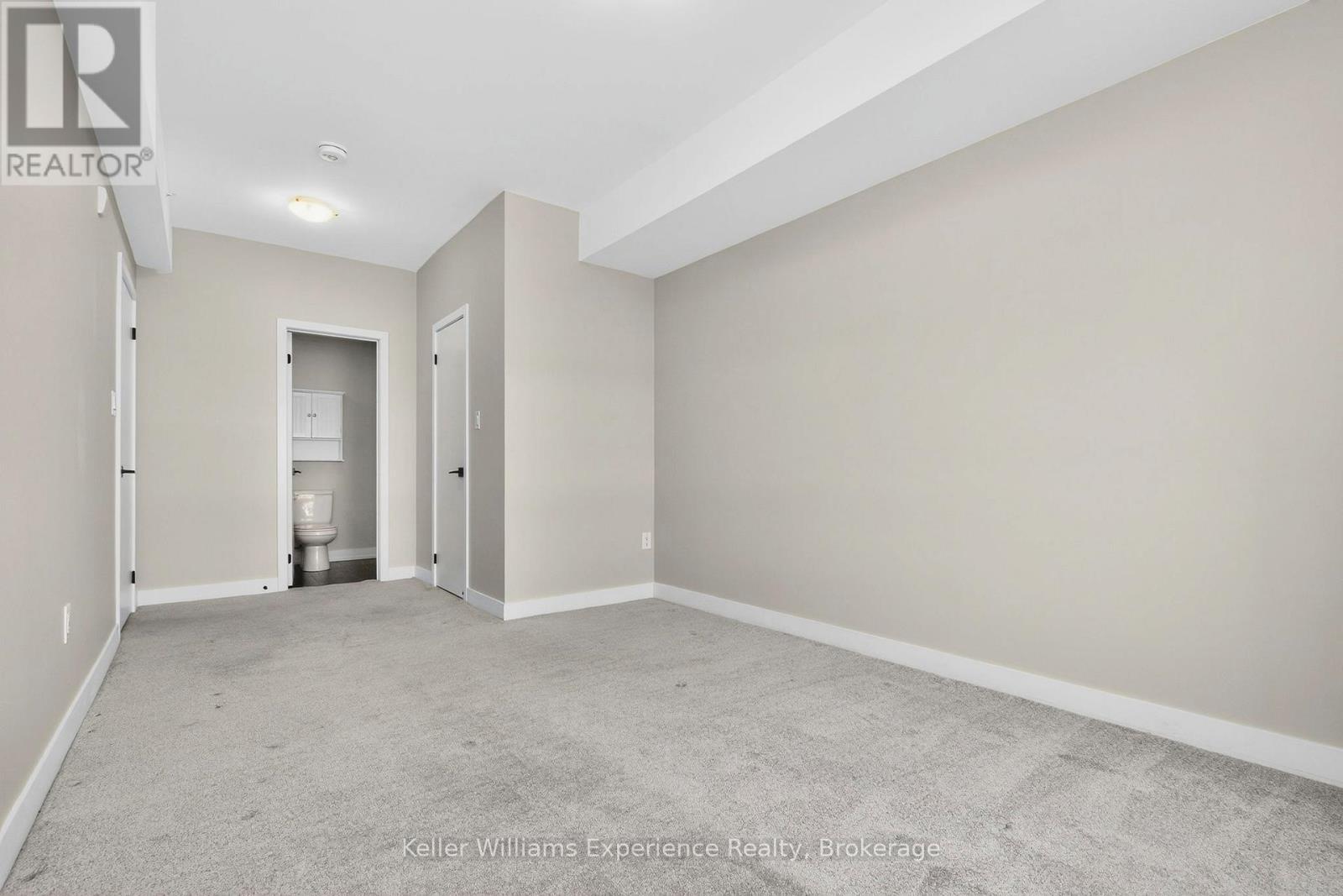 216 - 4 Spice Way, Barrie, ON - Indoor Photo Showing Other Room