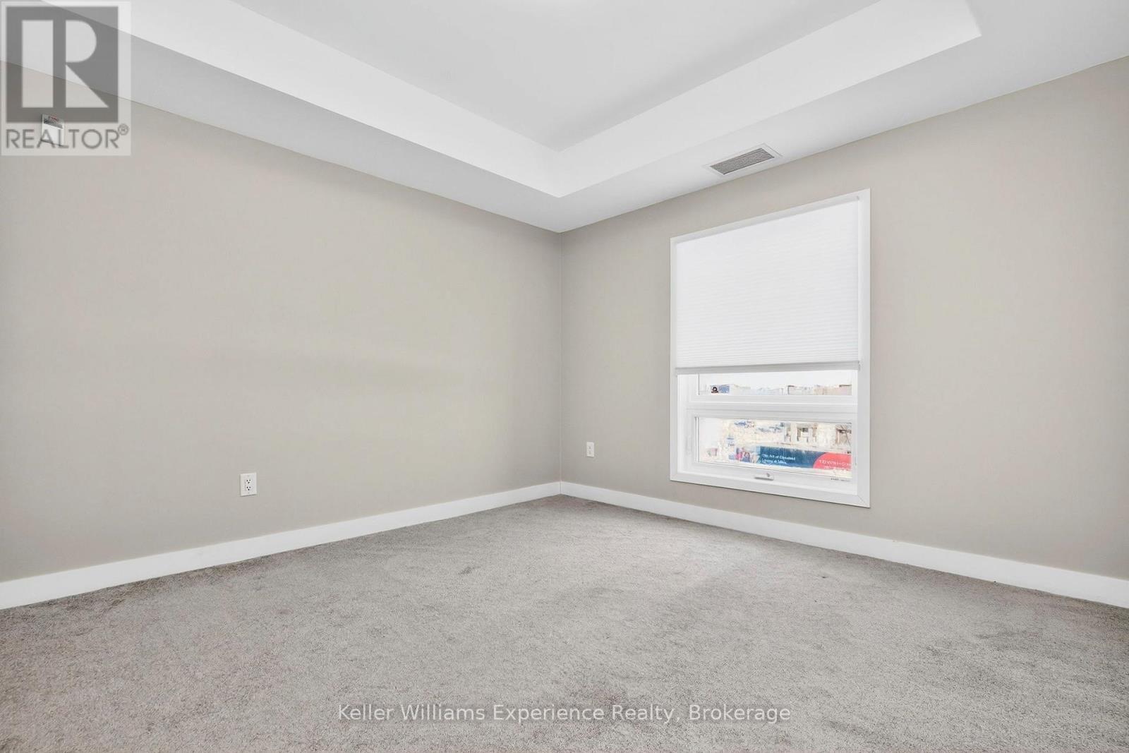 216 - 4 Spice Way, Barrie, ON - Indoor Photo Showing Other Room