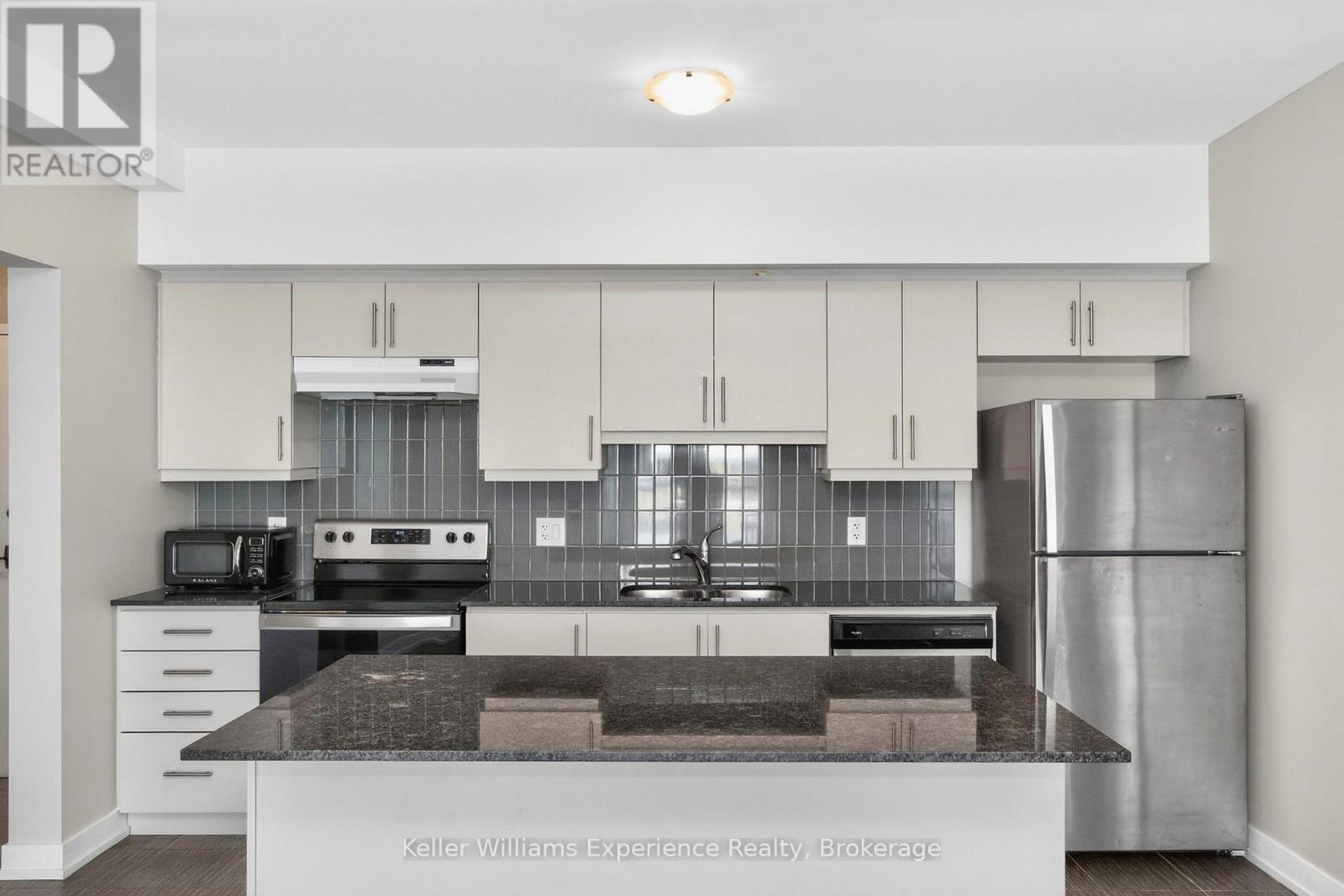 216 - 4 Spice Way, Barrie, ON - Indoor Photo Showing Kitchen With Stainless Steel Kitchen With Double Sink With Upgraded Kitchen