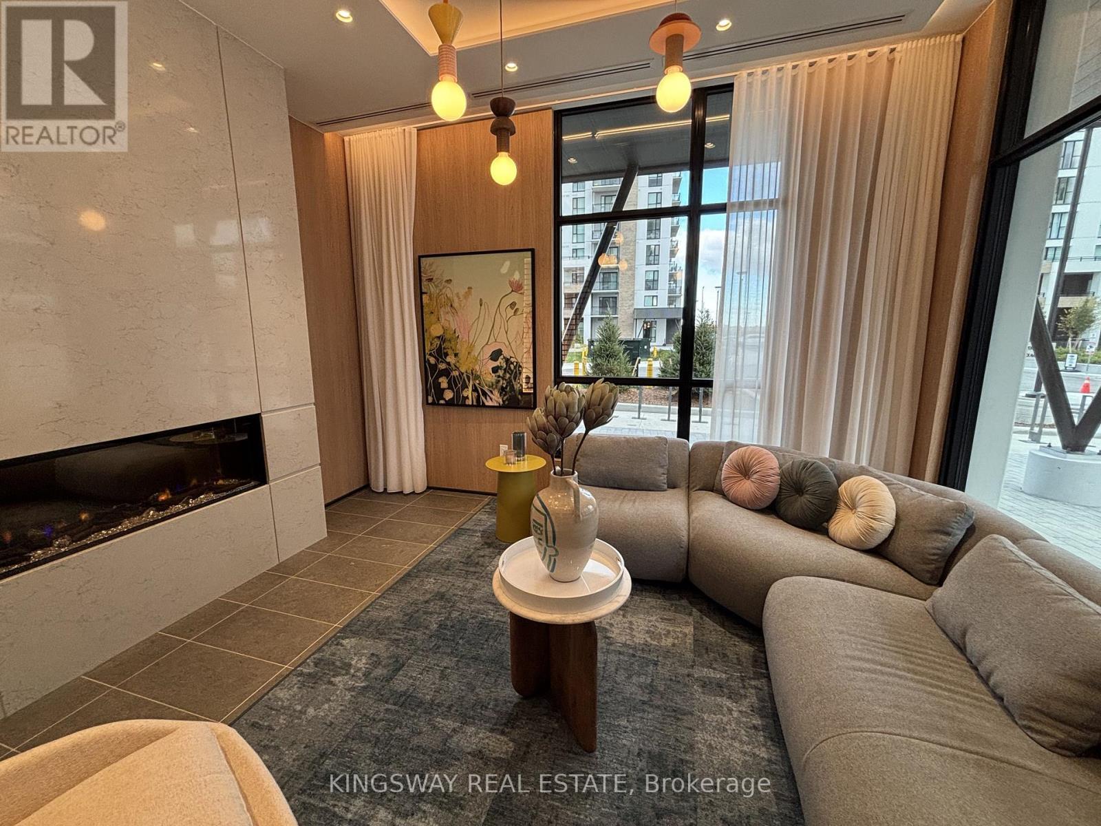 502 - 720 Whitlock Avenue, Milton, ON - Indoor Photo Showing Living Room With Fireplace