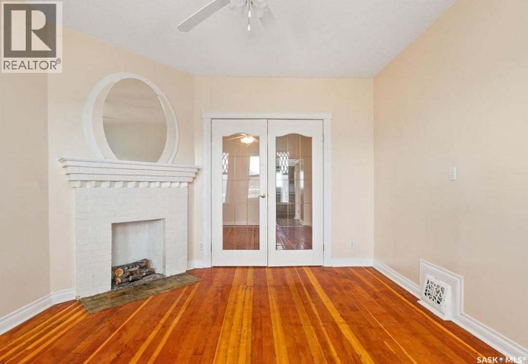 217 H Avenue S, Saskatoon, SK - Indoor Photo Showing Other Room With Fireplace