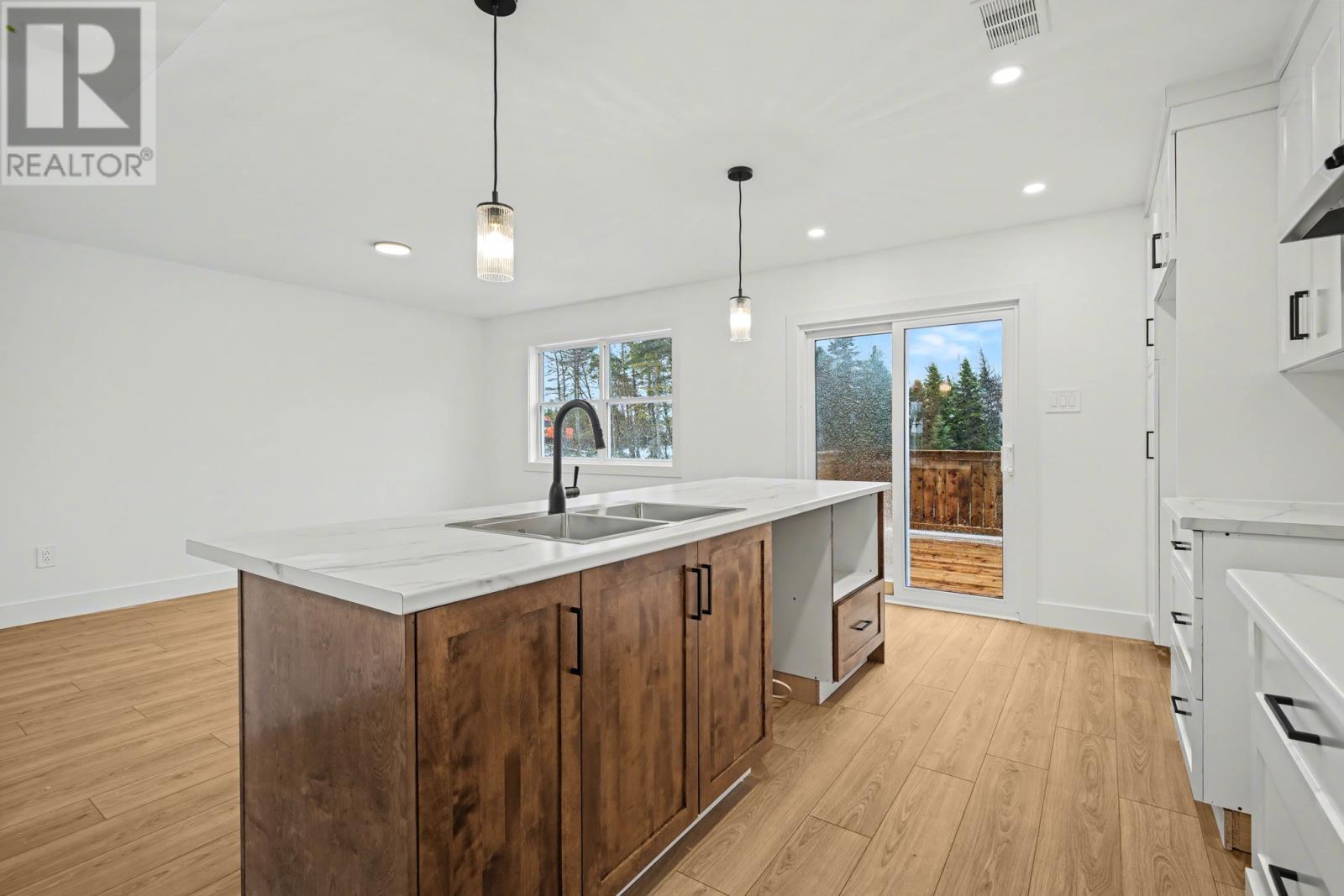 21-23 Cameron Place, Pouch Cove, NL - Indoor Photo Showing Kitchen With Double Sink