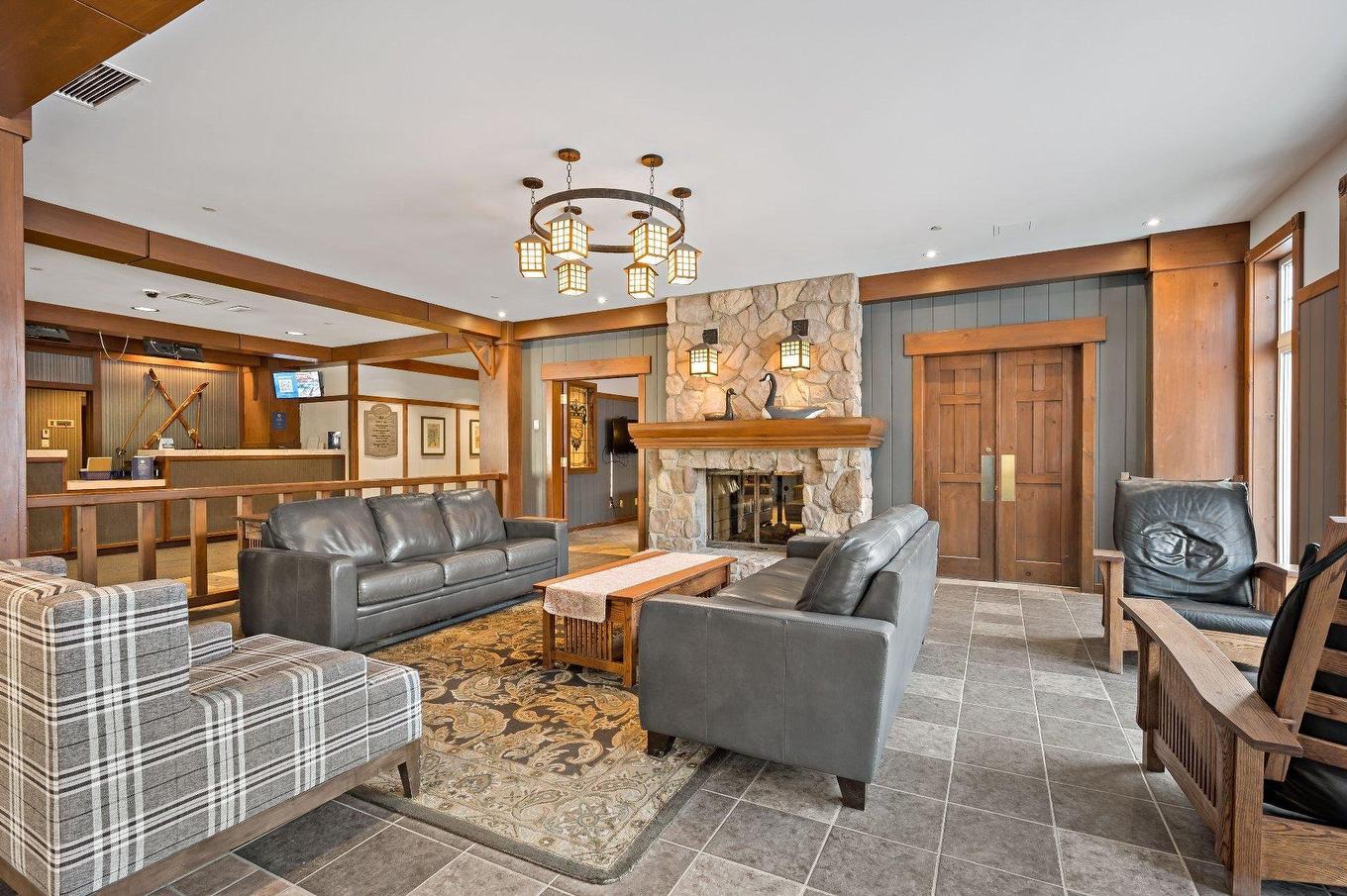 Autre - 320-151 Ch. Du Curé-Deslauriers, Mont-Tremblant, QC - Indoor Photo Showing Living Room With Fireplace
