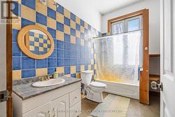 cheerfully tiled main bathroom -