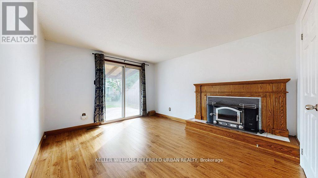 15 Thistlewaite Crescent, Toronto, ON - Indoor Photo Showing Living Room With Fireplace