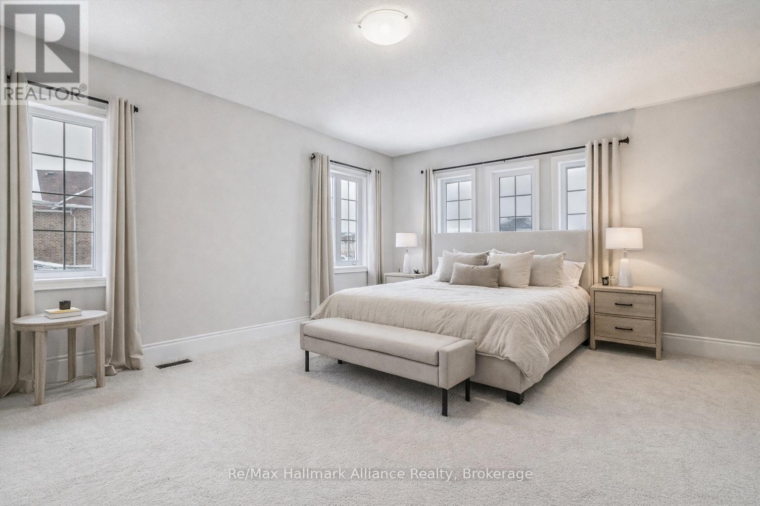 Primary Bedroom (Virtually Staged) - 425 Threshing Mill Boulevard, Oakville (Jm Joshua Meadows), ON - Indoor Photo Showing Bedroom