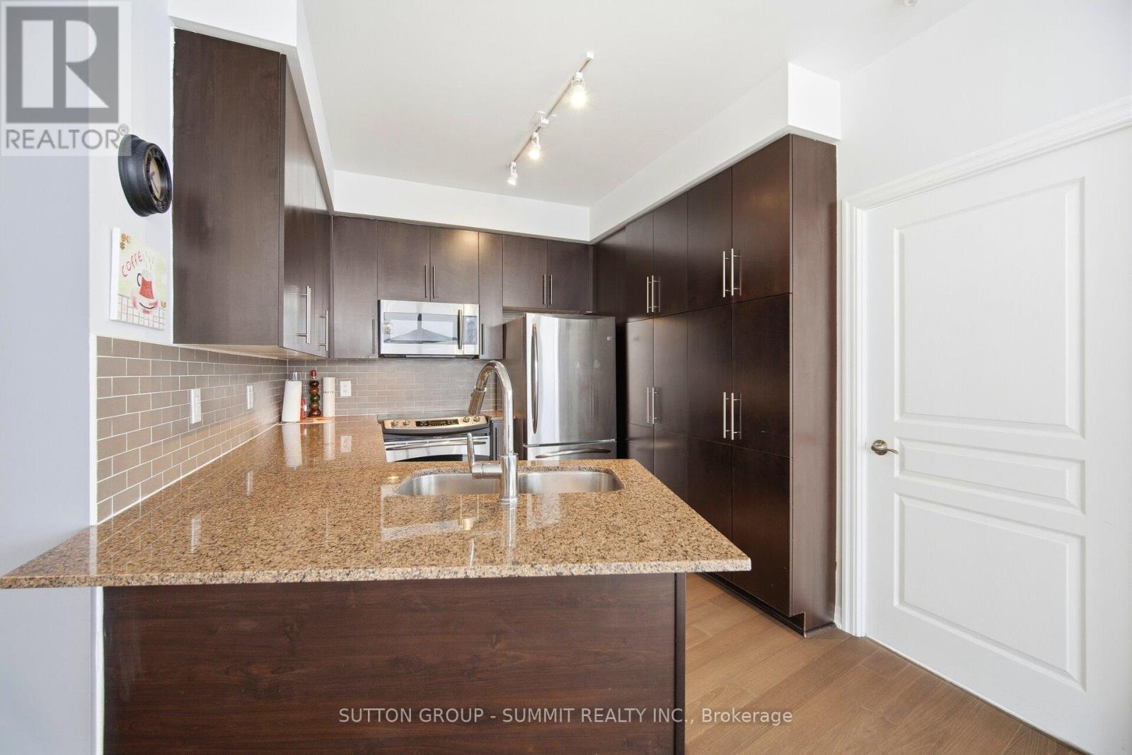 1705 - 223 Webb Drive, Mississauga, ON - Indoor Photo Showing Kitchen With Double Sink