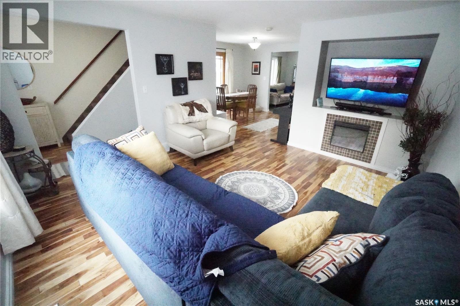 234 Lillooet Street Sw, Moose Jaw, SK - Indoor Photo Showing Living Room With Fireplace