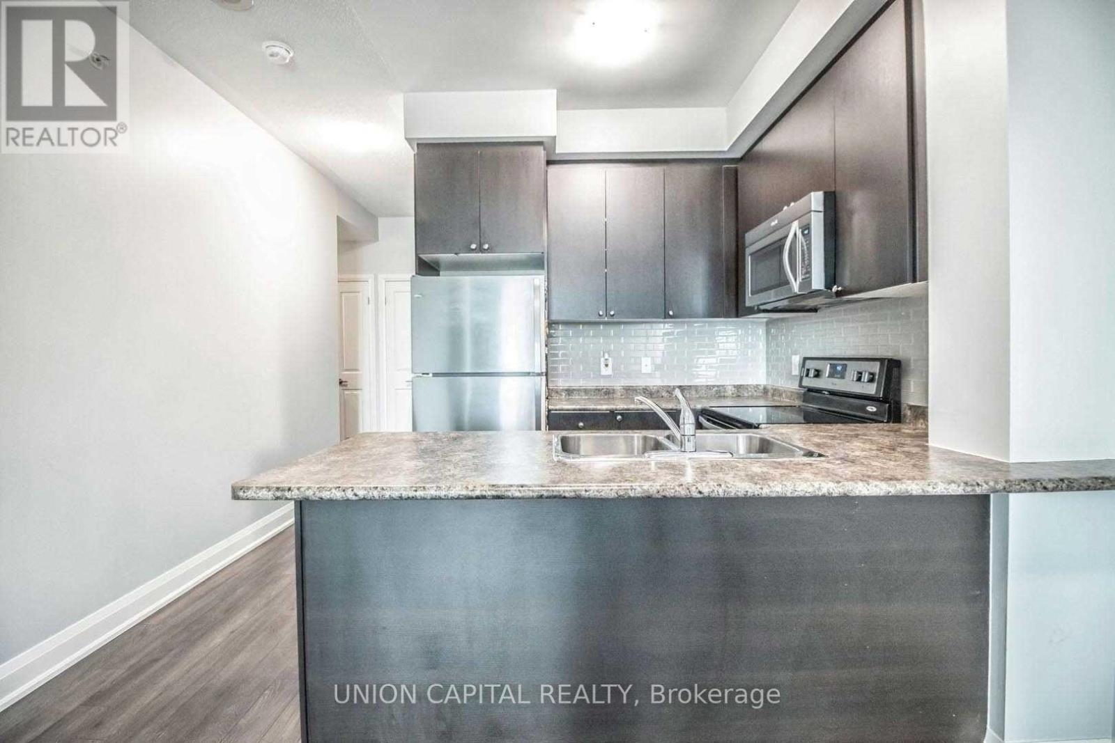 306 - 55 Yorkland Boulevard, Brampton, ON - Indoor Photo Showing Kitchen With Double Sink With Upgraded Kitchen