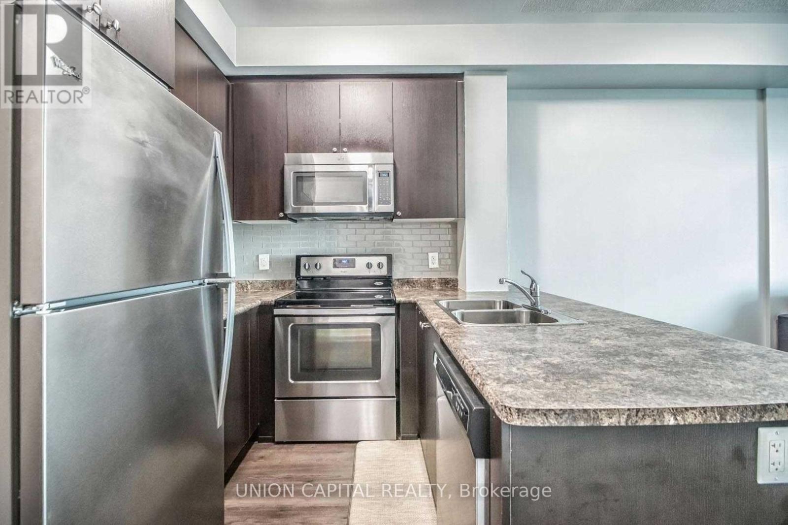306 - 55 Yorkland Boulevard, Brampton, ON - Indoor Photo Showing Kitchen With Stainless Steel Kitchen With Double Sink With Upgraded Kitchen