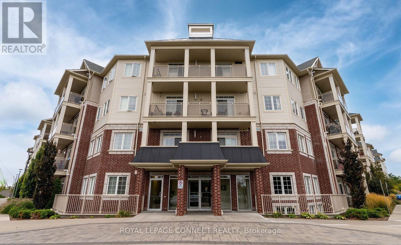 411 - 84 Aspen Springs Drive, Clarington, ON - Outdoor With Balcony With Facade
