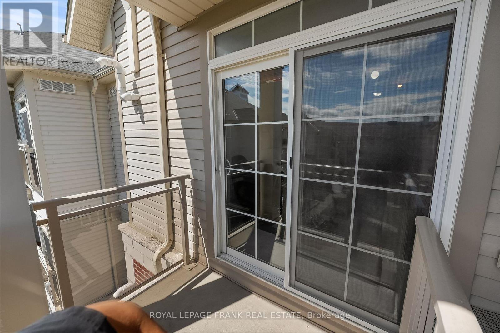 405 - 80 Aspen Springs Drive, Clarington (Bowmanville), ON - Outdoor With Balcony With Exterior