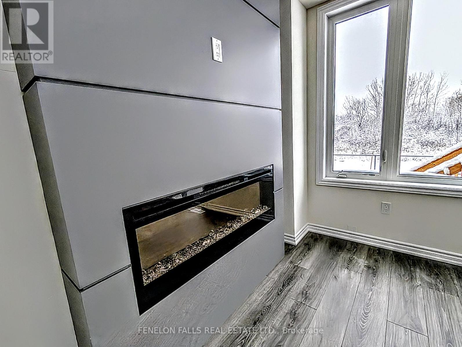 25 Hickey Lane, Kawartha Lakes (Lindsay), ON - Indoor With Fireplace