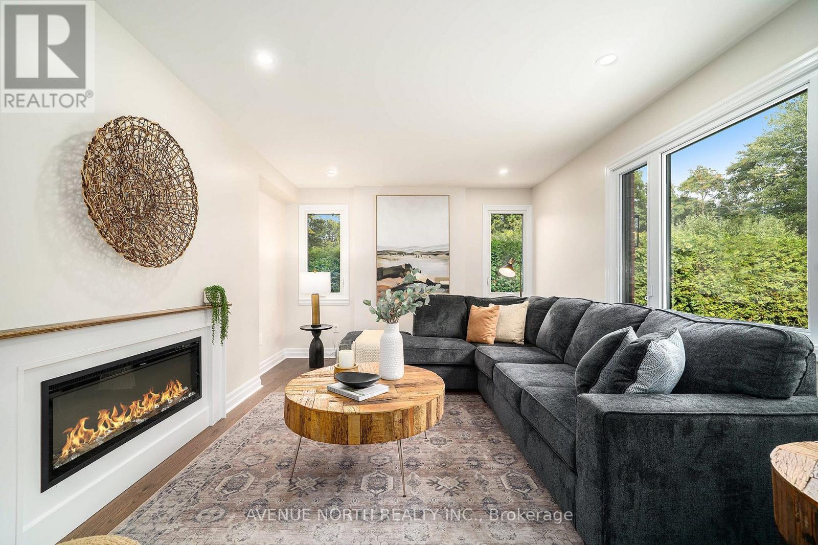 19 Newland Drive, Ottawa, ON - Indoor Photo Showing Living Room With Fireplace