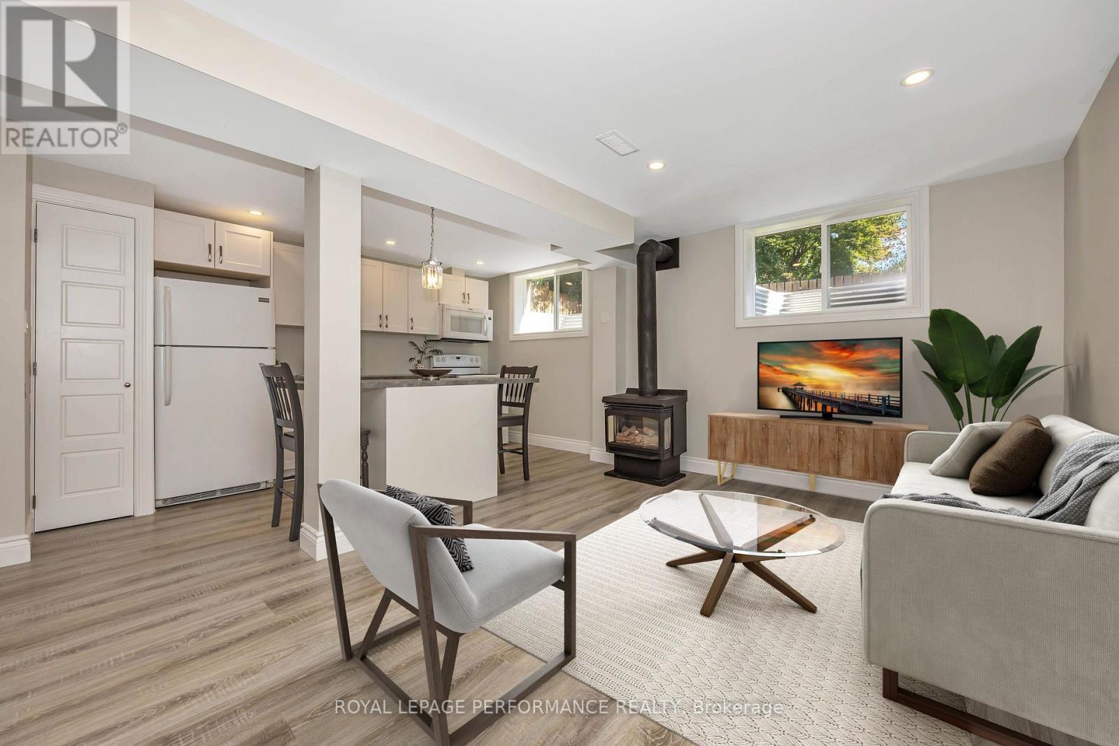 Virtually staged living room - B - 336 Tulip Crescent, Ottawa, ON - Indoor Photo Showing Living Room With Fireplace