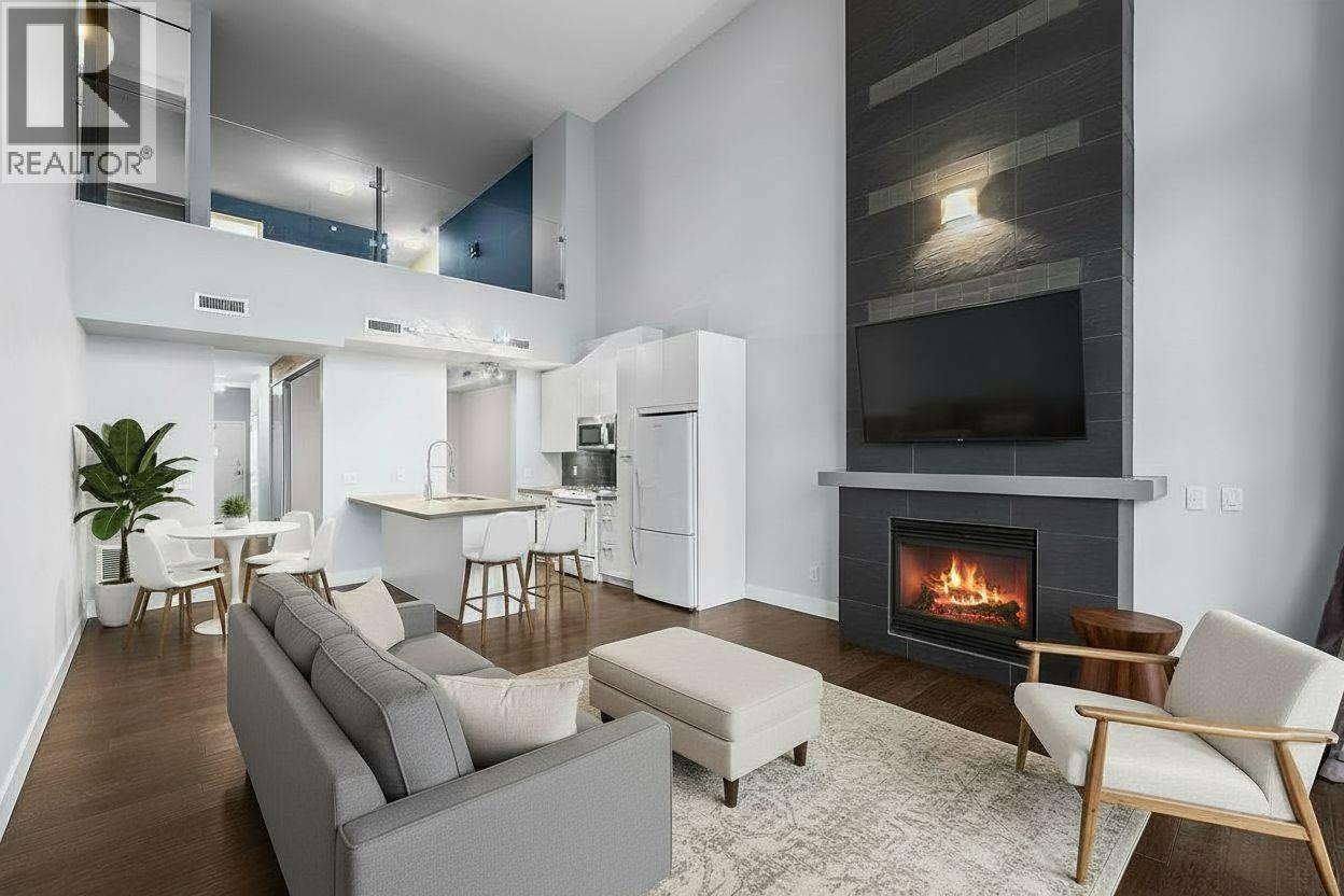 virtually staged - 1289 Ellis Street Unit# 411, Kelowna, BC - Indoor Photo Showing Living Room With Fireplace