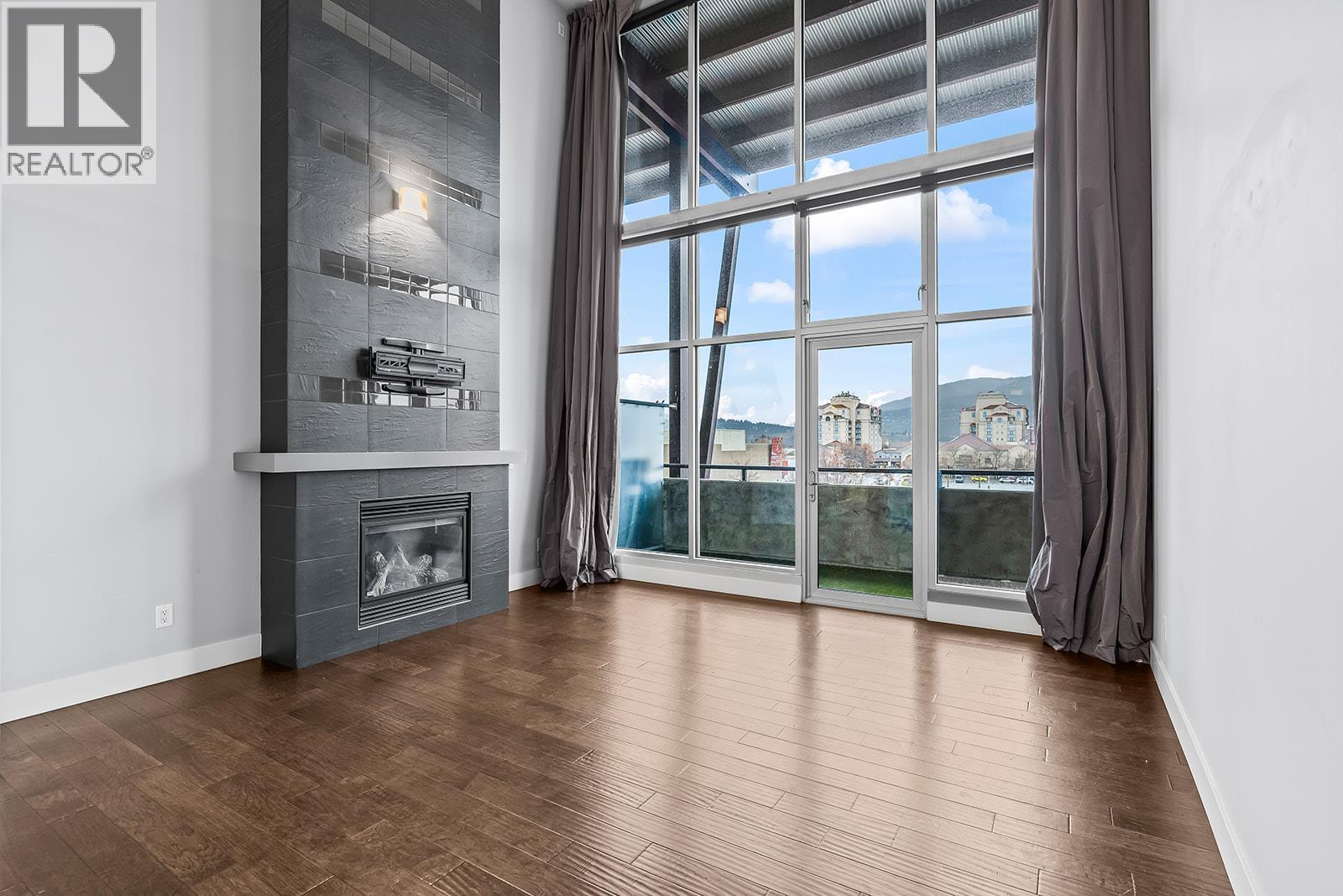 1289 Ellis Street Unit# 411, Kelowna, BC - Indoor With Fireplace