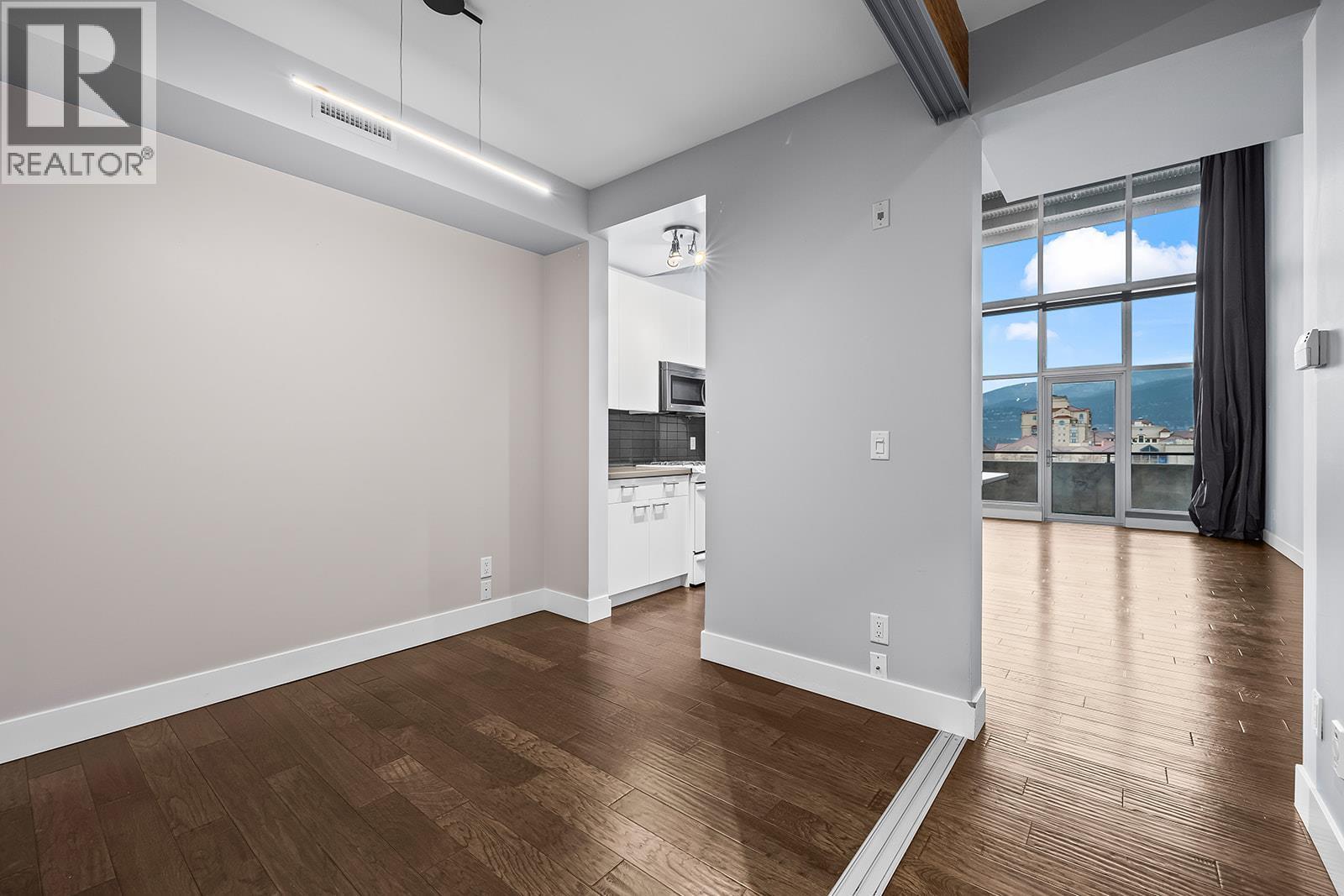 den with sliding doors for privacy - 1289 Ellis Street Unit# 411, Kelowna, BC - Indoor Photo Showing Other Room