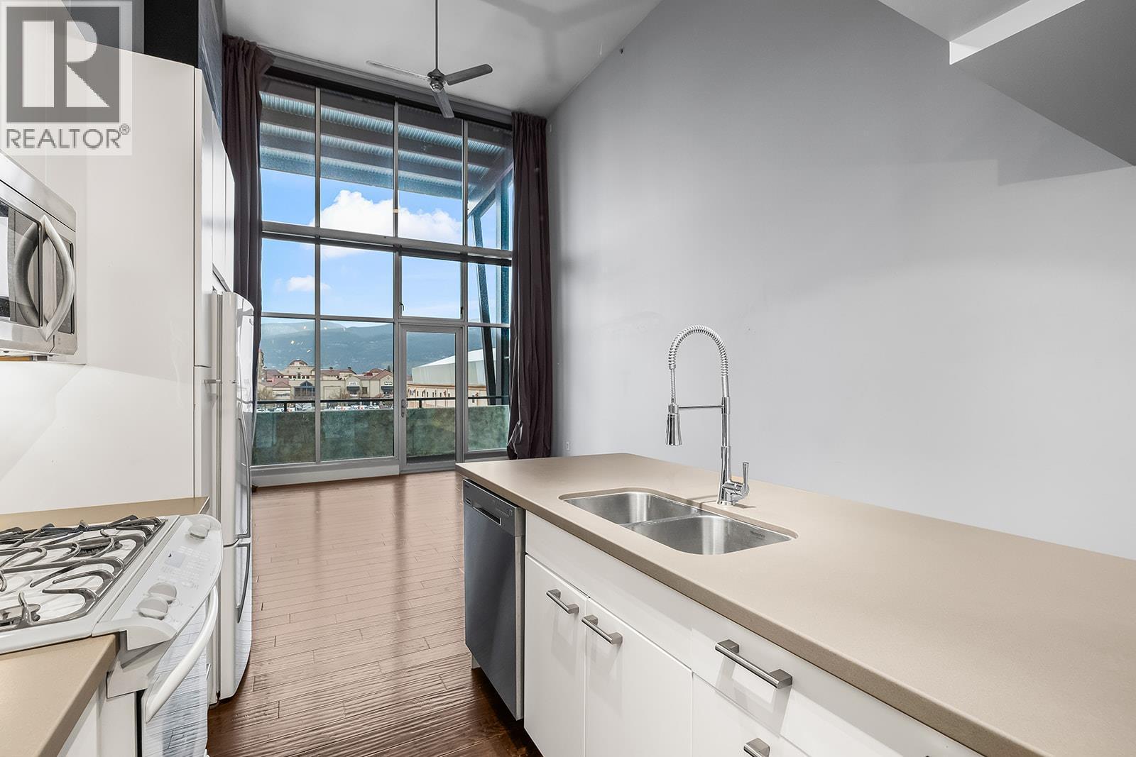 1289 Ellis Street Unit# 411, Kelowna, BC - Indoor Photo Showing Kitchen With Double Sink
