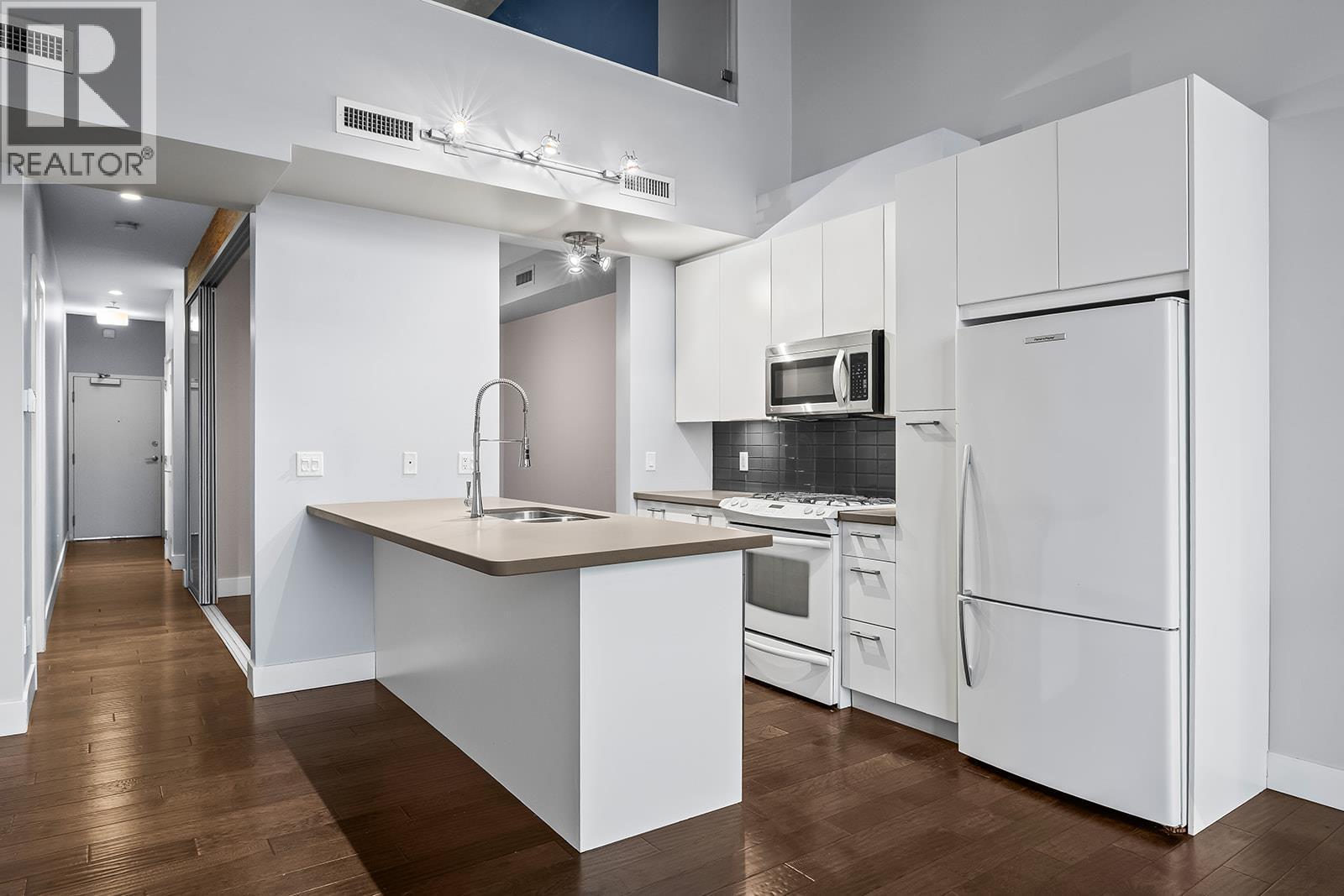 1289 Ellis Street Unit# 411, Kelowna, BC - Indoor Photo Showing Kitchen With Double Sink