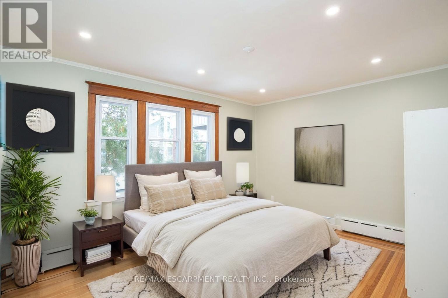 Virtually Staged - Bedroom 1 - 1 - 22 Prospect Street S, Hamilton, ON - Indoor Photo Showing Bedroom