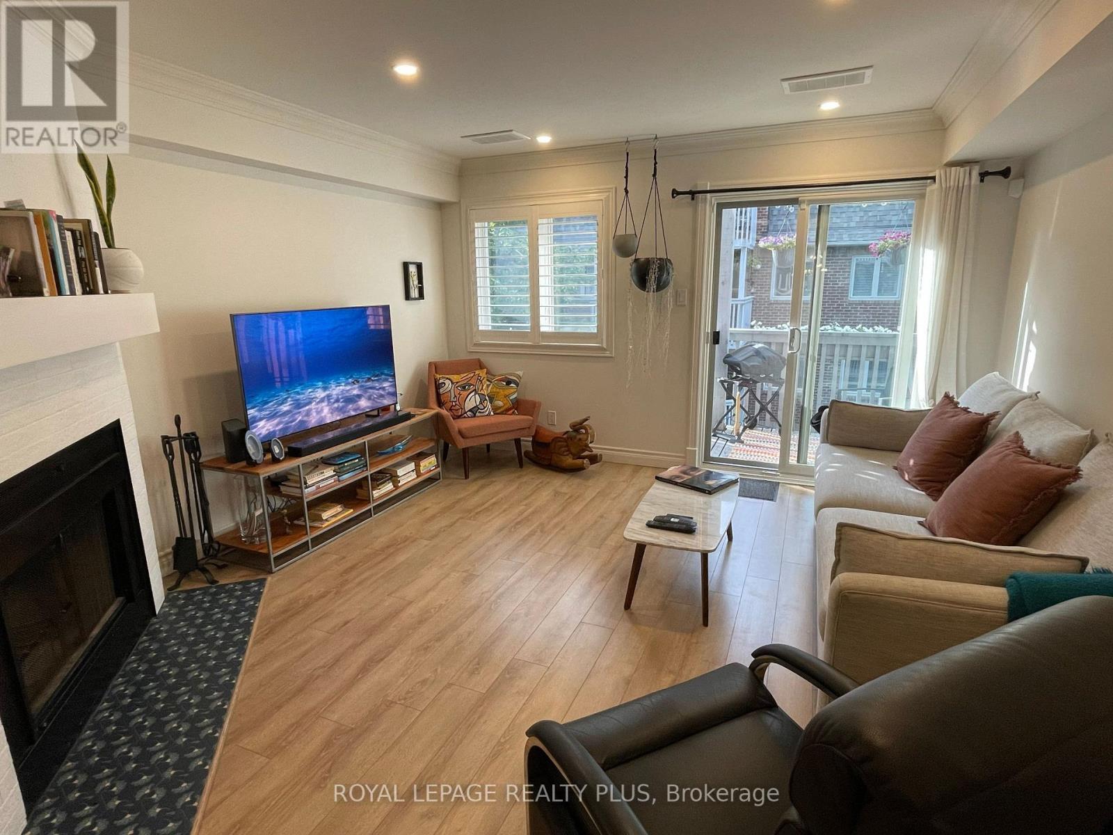 38C Shank Street, Toronto, ON - Indoor Photo Showing Living Room With Fireplace