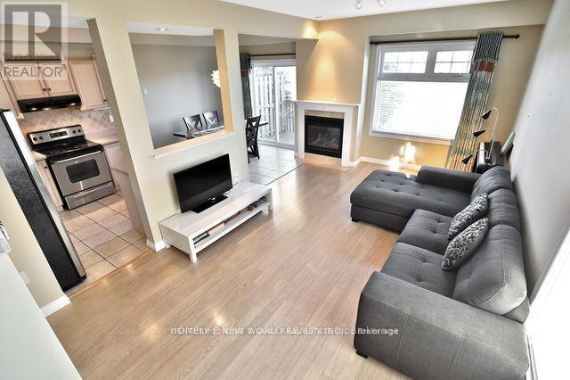21 - 232 Stonehenge Drive, Hamilton, ON - Indoor Photo Showing Living Room With Fireplace
