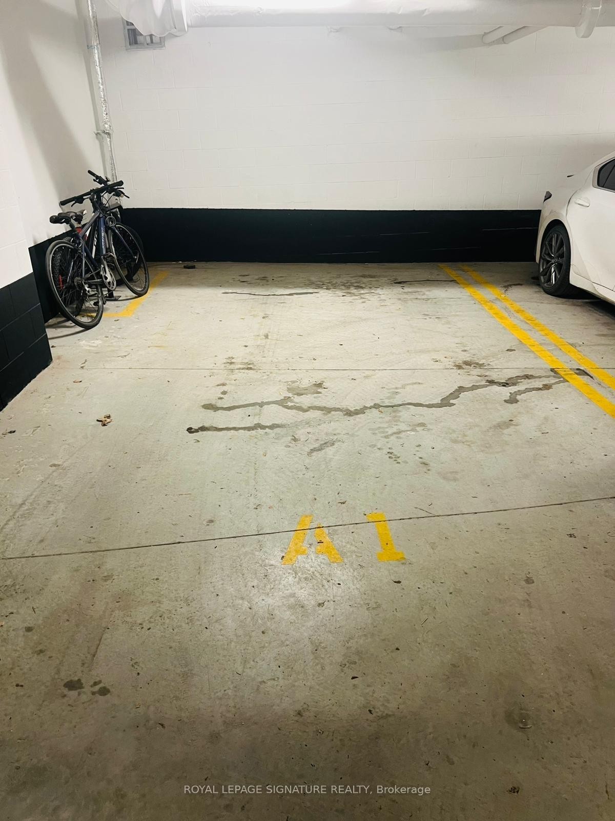 188 F-1608 Charles Street W, Whitby, ON - Indoor Photo Showing Garage