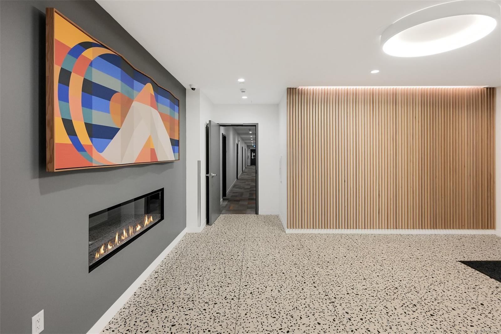 407-1115 Johnson St, Victoria, BC - Indoor Photo Showing Other Room With Fireplace