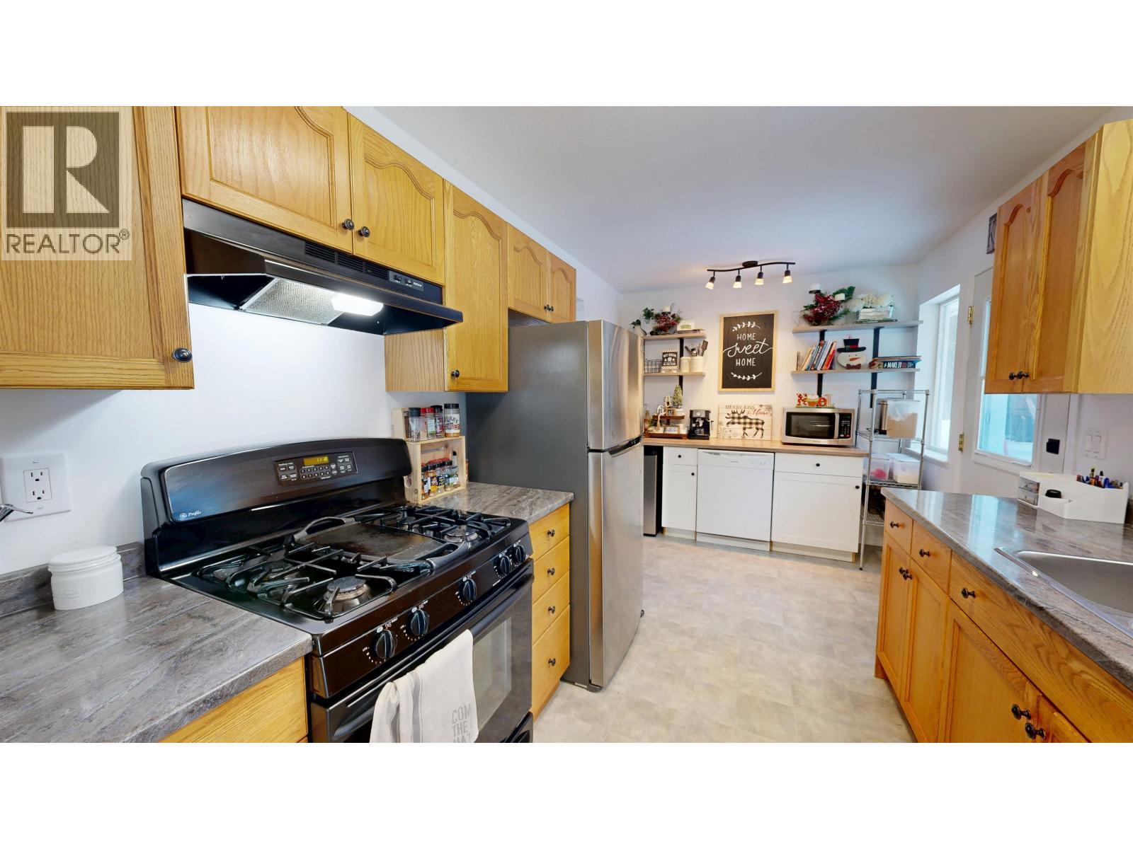 4983 Smith Road, 108 Mile Ranch, BC - Indoor Photo Showing Kitchen