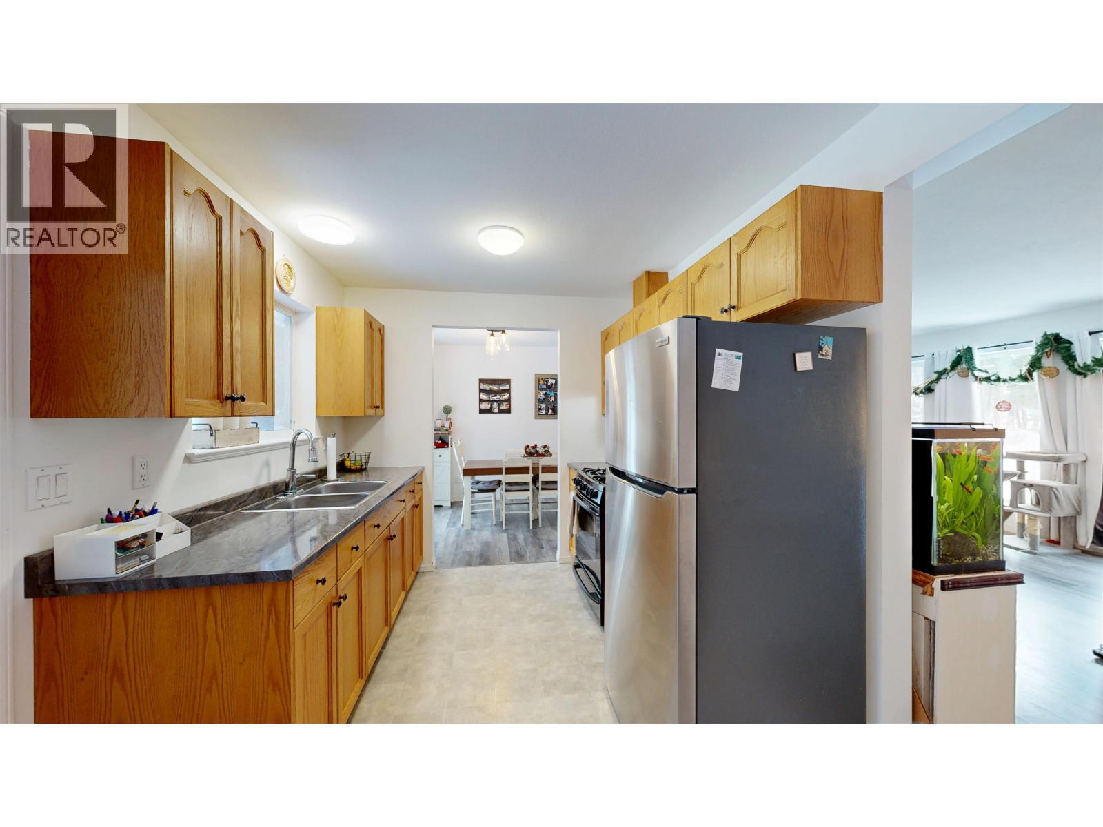 4983 Smith Road, 108 Mile Ranch, BC - Indoor Photo Showing Kitchen With Double Sink