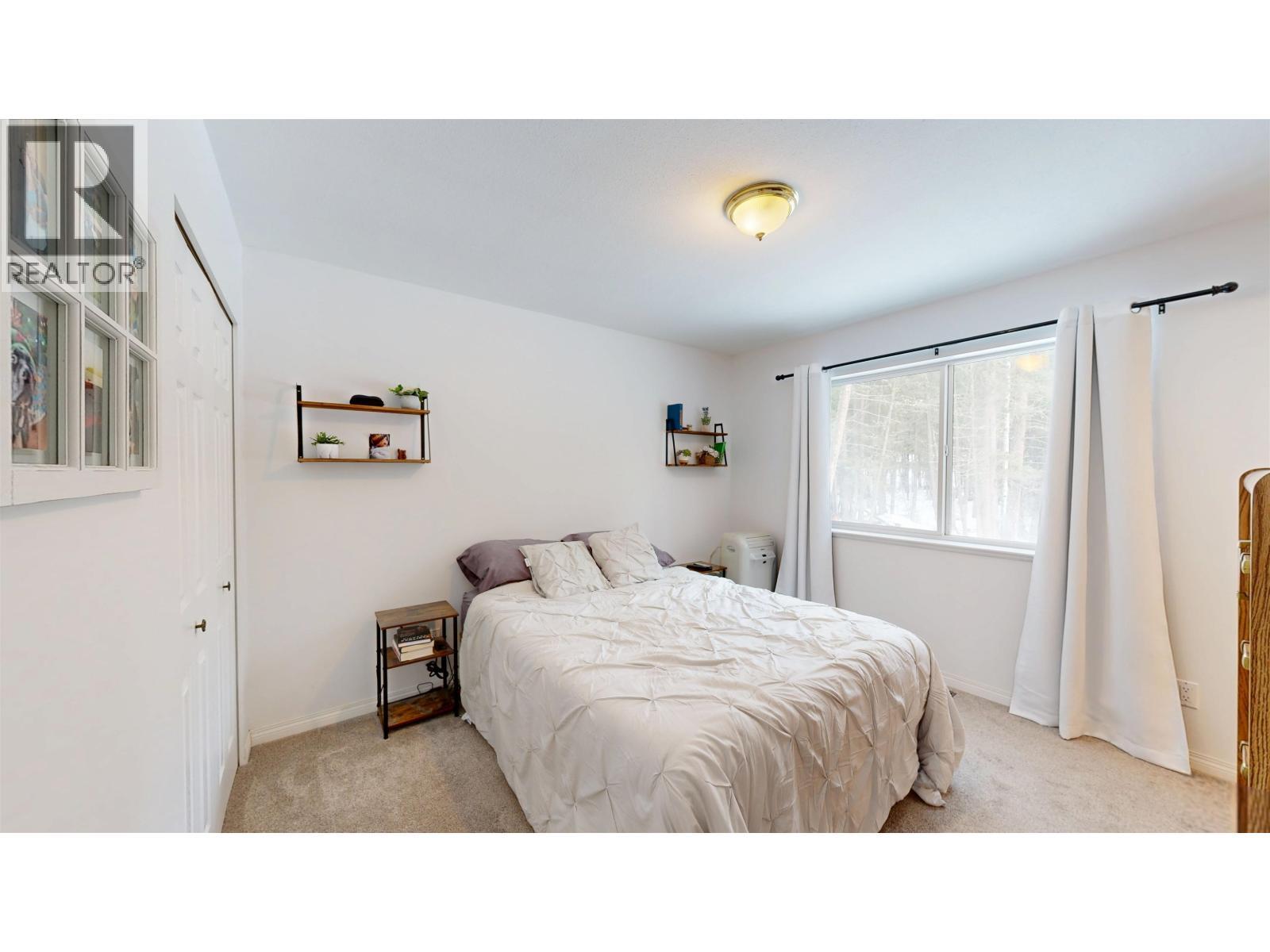 4983 Smith Road, 108 Mile Ranch, BC - Indoor Photo Showing Bedroom