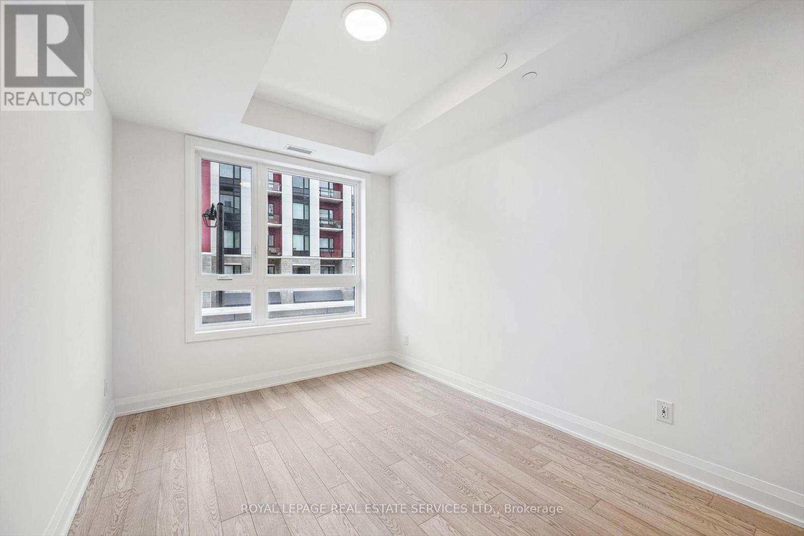 Primary Bedroom with Wide Plank Laminate Flooring - 223 - 3250 Carding Mill Trail, Oakville, ON - Indoor Photo Showing Other Room
